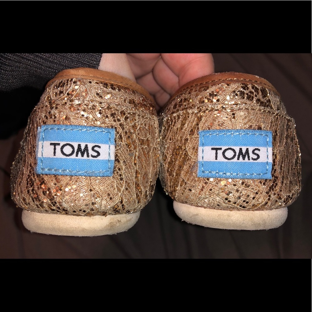 Gold slip on Toms
